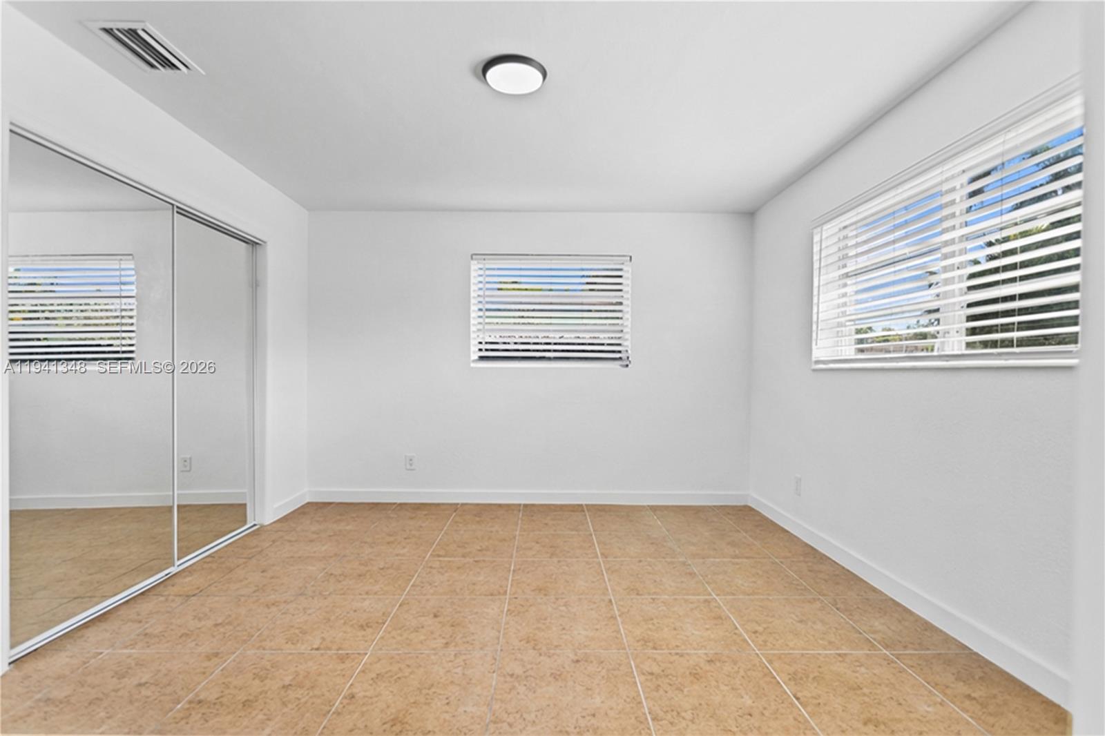 3253 Pierce Street Hollywood, FL 33021 - Photo 22 of 53 an empty room with a empty space and windows