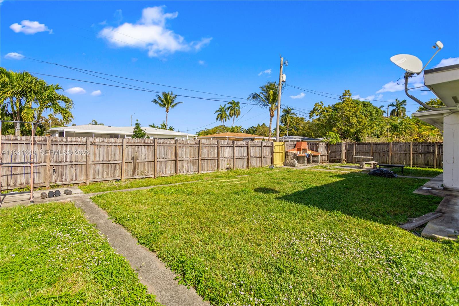 3253 Pierce Street Hollywood, FL 33021 - Photo 25 of 53 a view of a garden with a slide