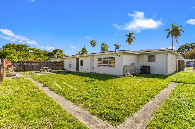 a bathroom with a sink a toilet and a shower