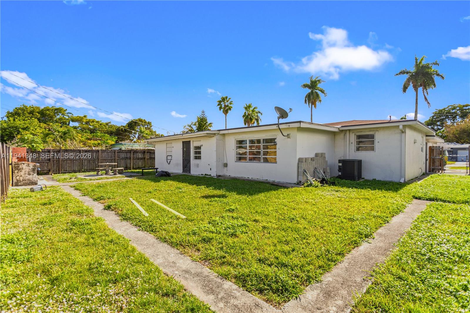 3253 Pierce Street Hollywood, FL 33021 - Photo 27 of 53 a front view of a house with a yard