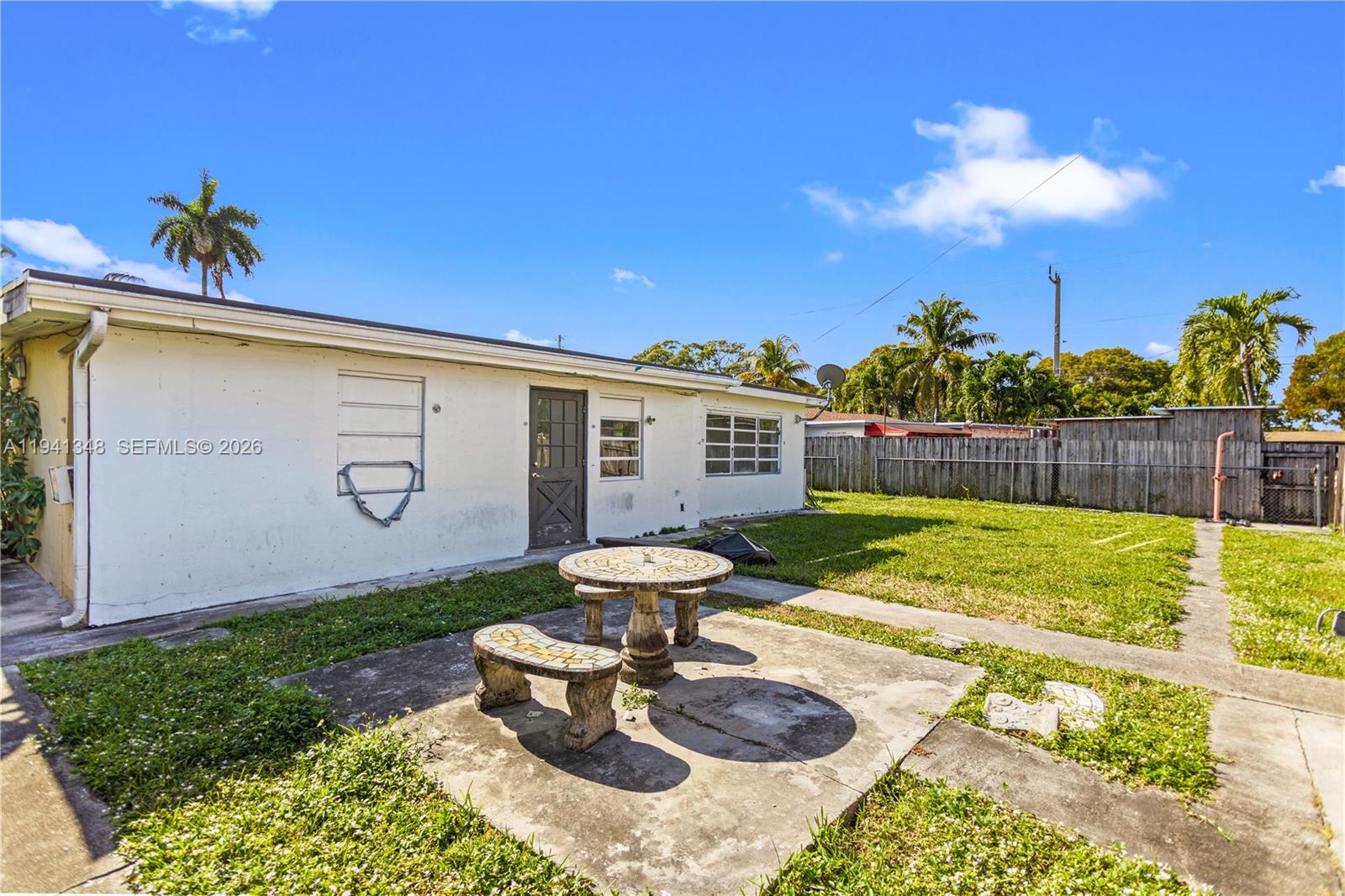 3253 Pierce Street Hollywood, FL 33021 - Photo 28 of 53 a view of a backyard with plants and patio