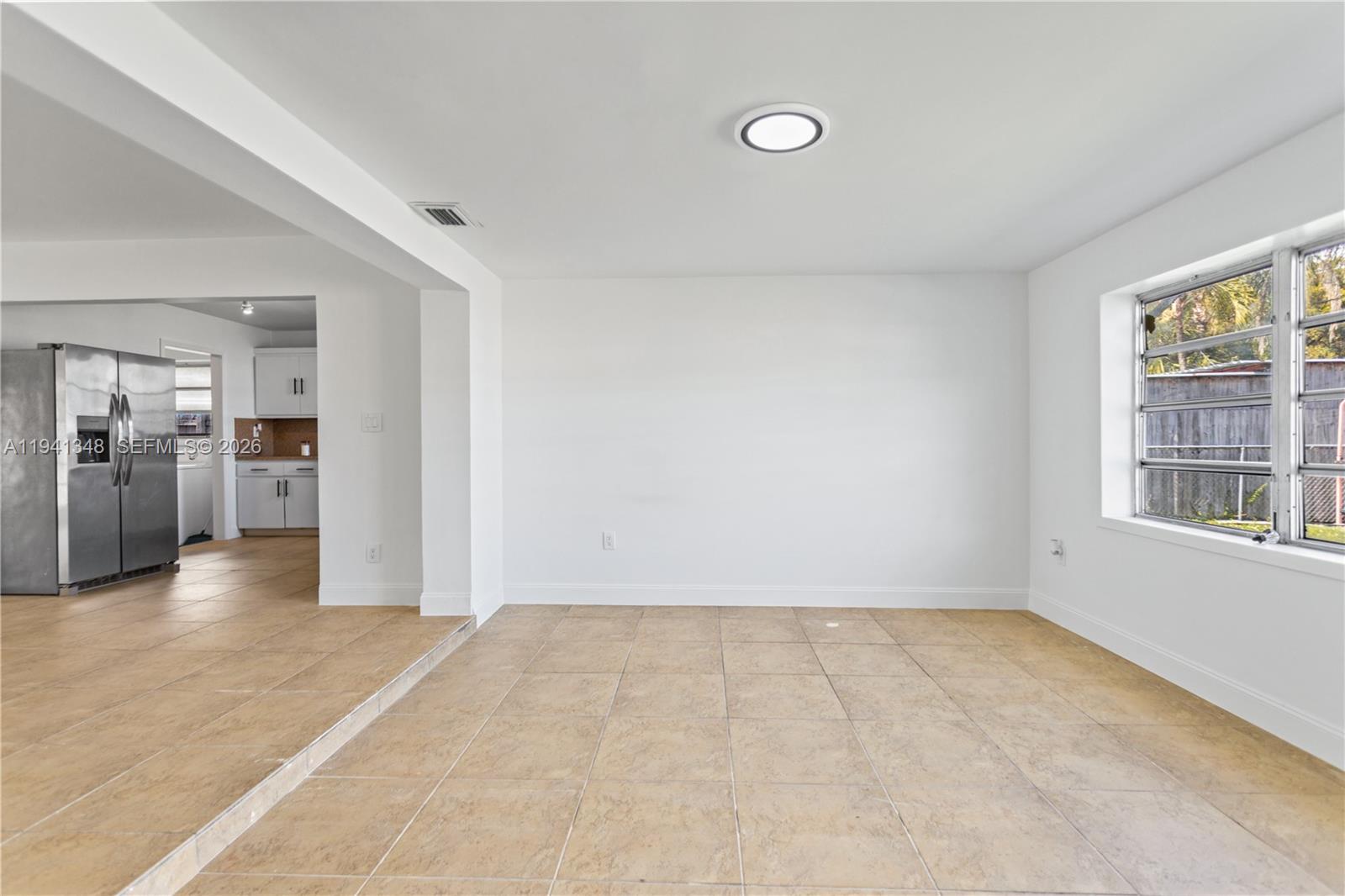 3253 Pierce Street Hollywood, FL 33021 - Photo 33 of 53 a view of an empty room with kitchen and window