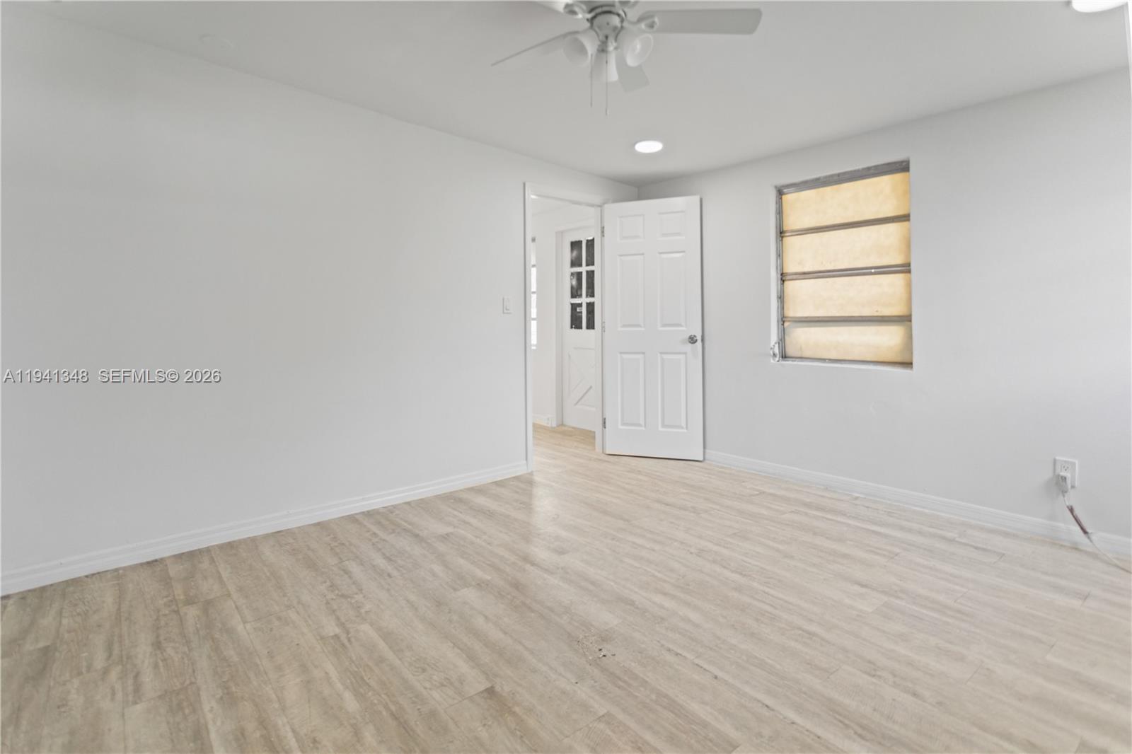3253 Pierce Street Hollywood, FL 33021 - Photo 35 of 53 wooden floor in an empty room with a window