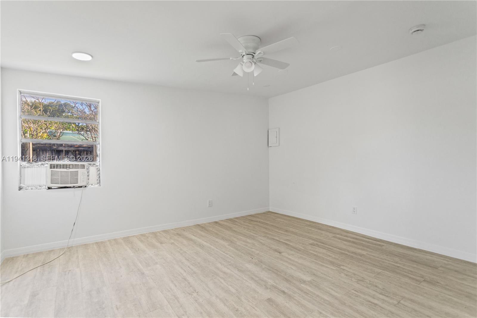 3253 Pierce Street Hollywood, FL 33021 - Photo 36 of 53 wooden floor in an empty room with a window