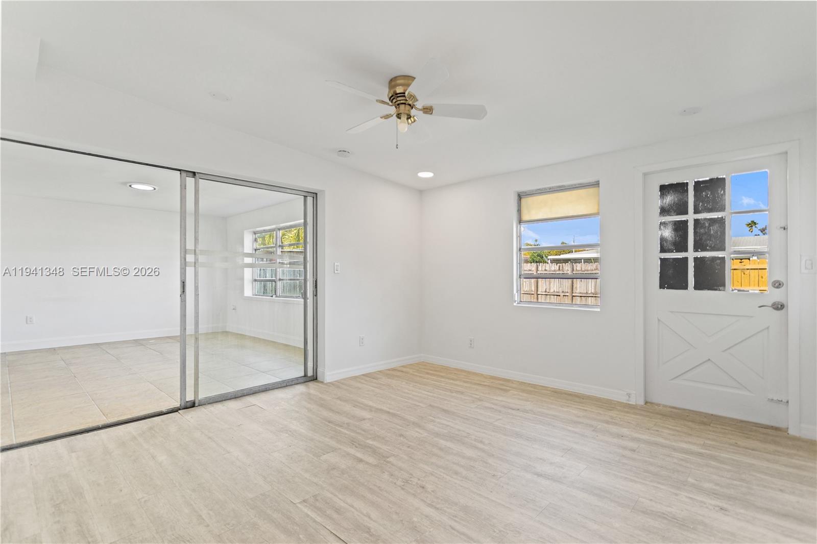 3253 Pierce Street Hollywood, FL 33021 - Photo 39 of 53 wooden floor in an empty room with a window