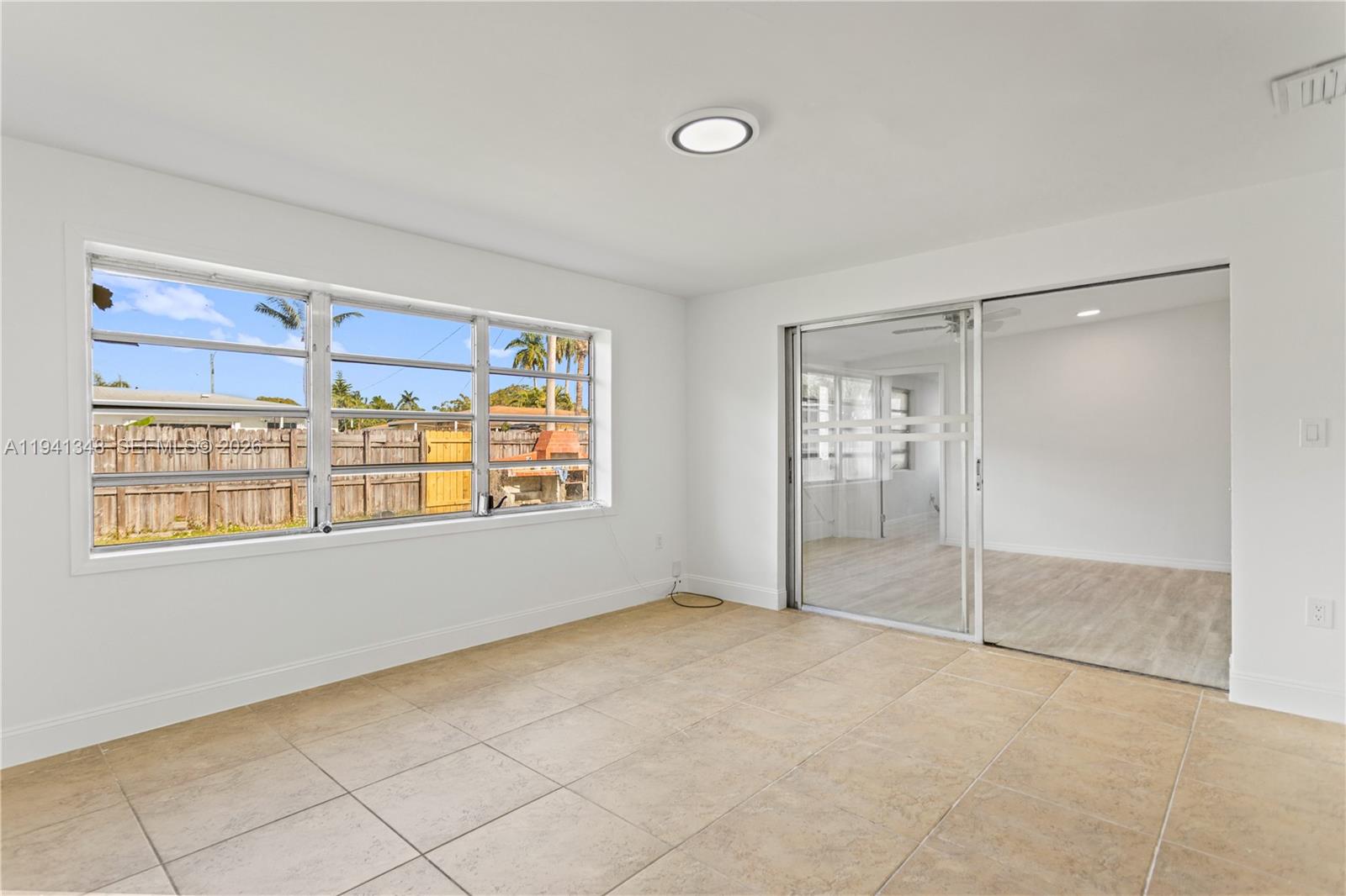 3253 Pierce Street Hollywood, FL 33021 - Photo 41 of 53 a view of an empty room with a window