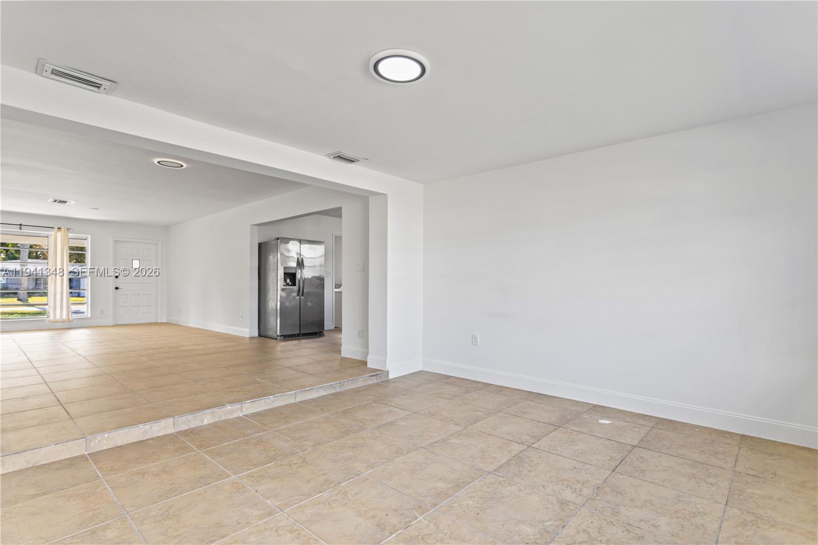 3253 Pierce Street Hollywood, FL 33021 - Photo 45 of 53 a view of an empty room with cabinet and a window