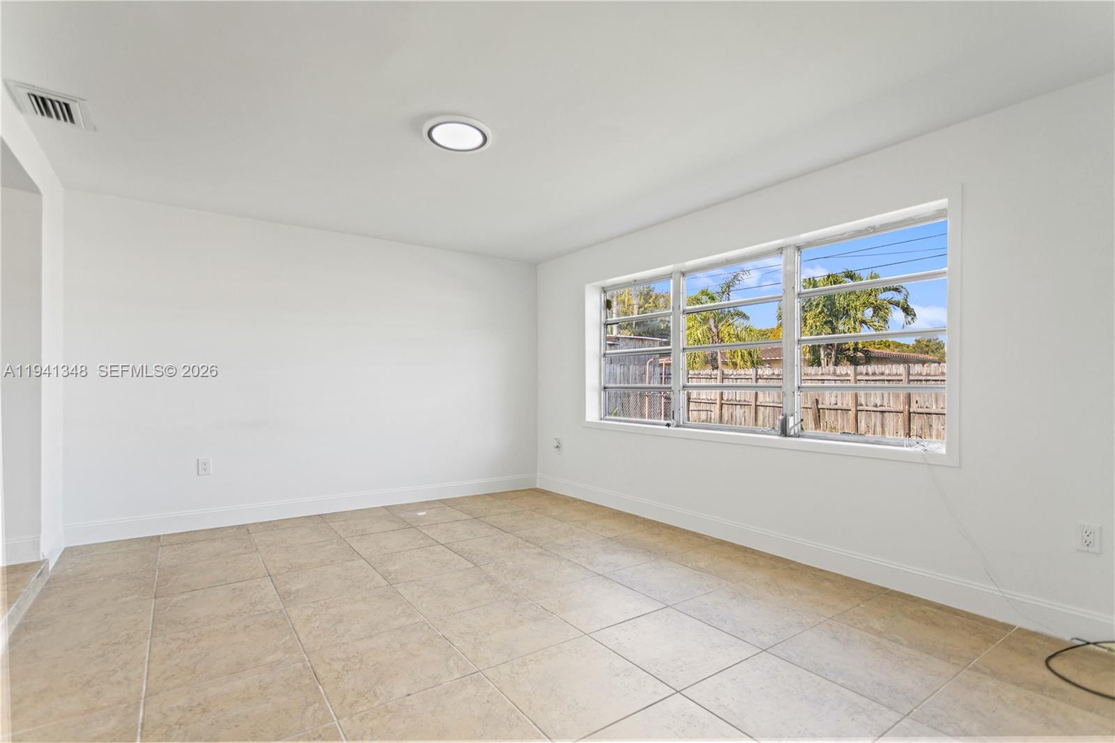 3253 Pierce Street Hollywood, FL 33021 - Photo 46 of 53 a view of an empty room with a window