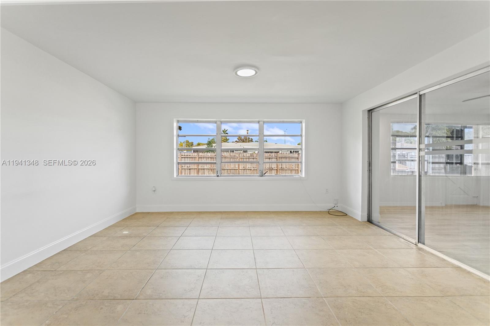 3253 Pierce Street Hollywood, FL 33021 - Photo 47 of 53 a view of an empty room with a window