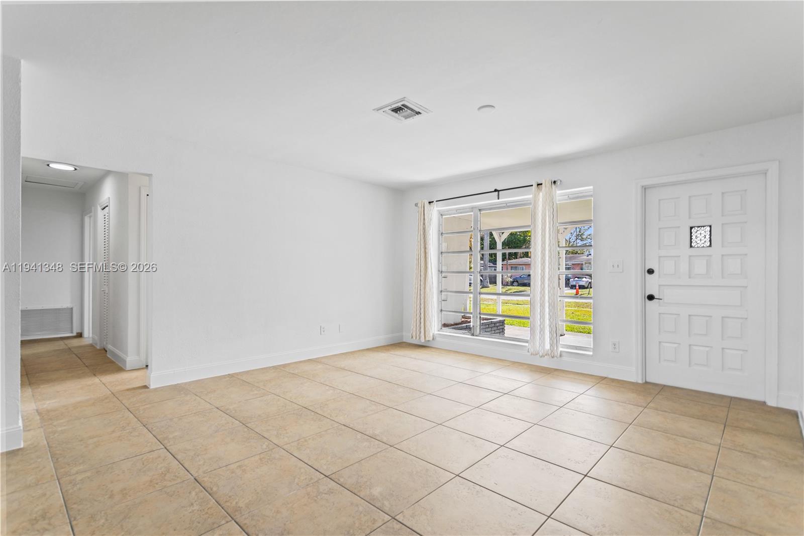 3253 Pierce Street Hollywood, FL 33021 - Photo 7 of 53 a view of an empty room with a window