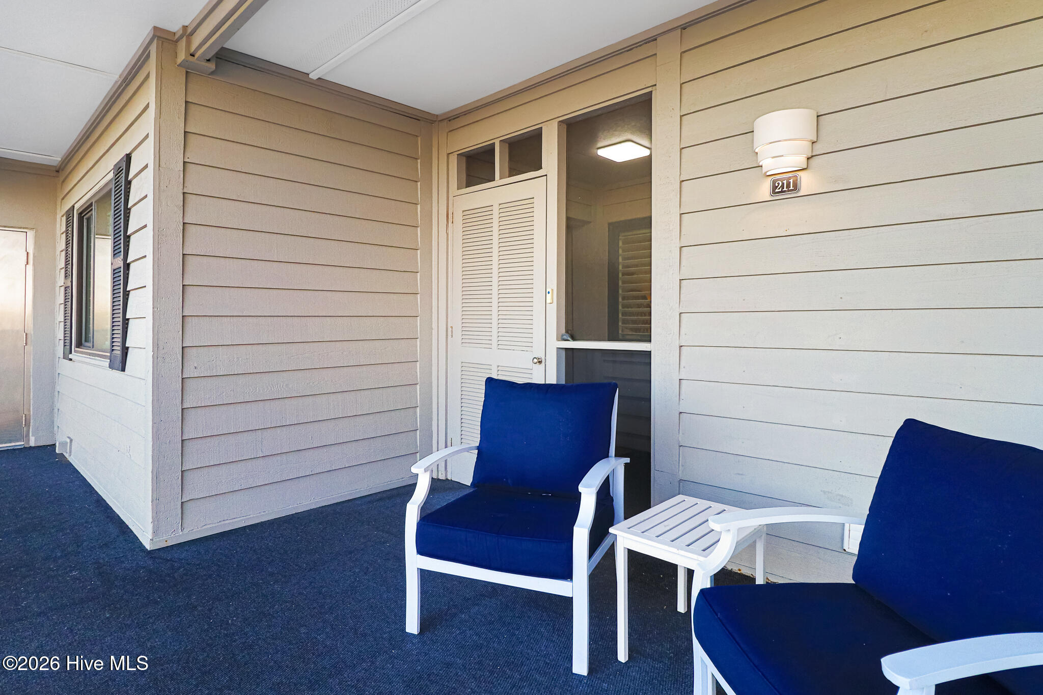 2111 West Fort Macon Road, Unit 211 DUNESCAPE Atlantic Beach, NC 28512 - Photo 11 of 39 Entry with Seating