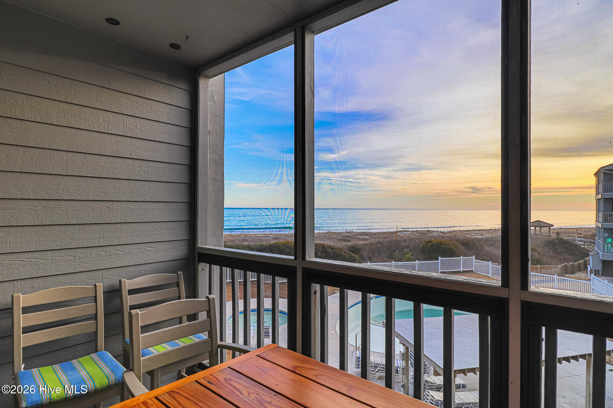 2111 West Fort Macon Road, Unit 211 DUNESCAPE Atlantic Beach, NC 28512 - Photo 27 of 39 Screened Porch off of living room