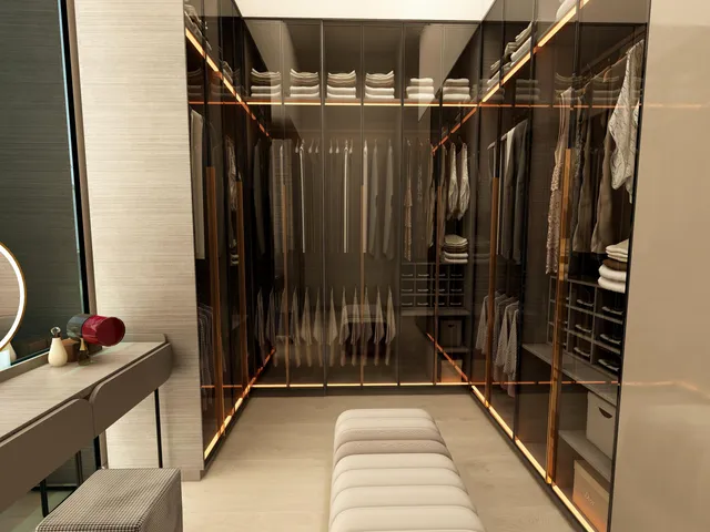 a view of walk in closet with clothes