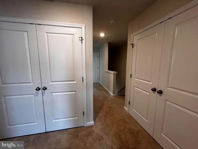 a view of a bathroom with a glass door shower