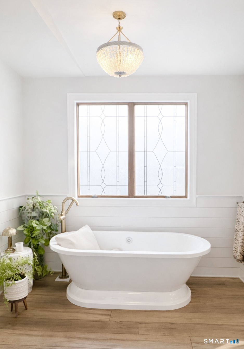 34 Orchard Road Milford, CT 06460 - Photo 15 of 25 a bathroom with a tub and sink