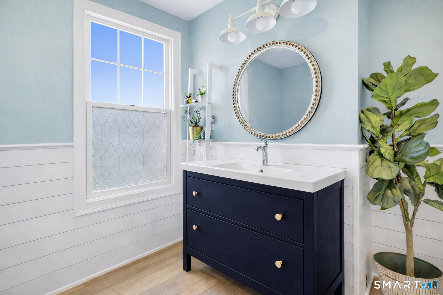 34 Orchard Road Milford, CT 06460 - Photo 23 of 25 a bathroom with a sink and a mirror