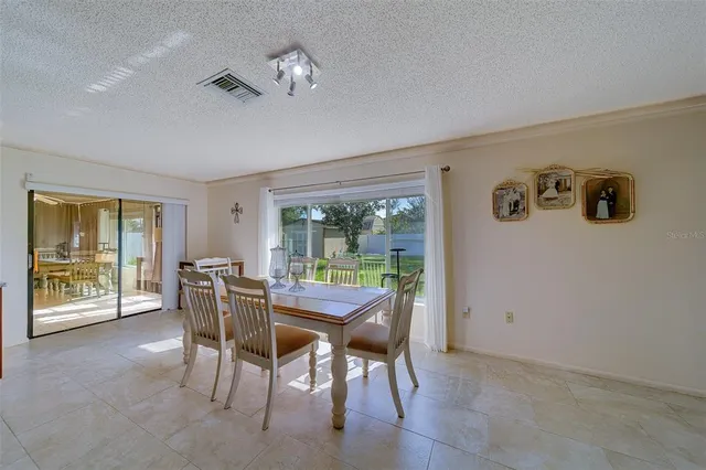 a view of a dining room with furniture window and outside view