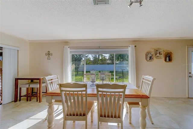 a bedroom with a bed closet and flat screen tv