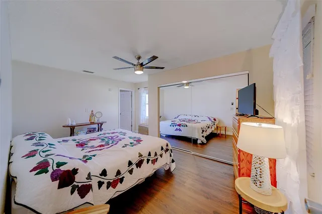 a bedroom with a bed and a dresser