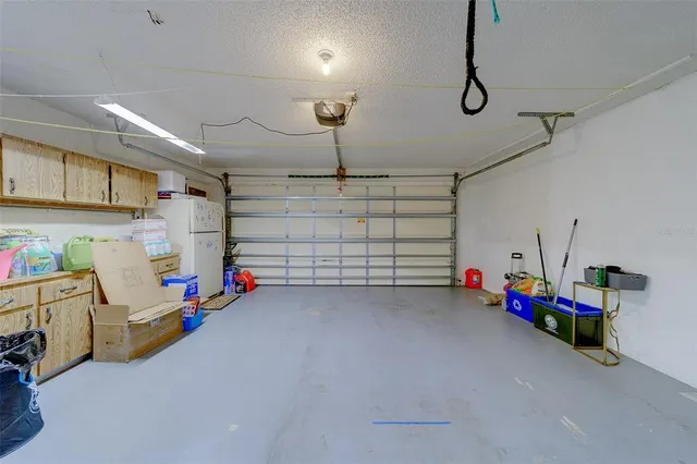 a front view of the house with yard patio and fire pit