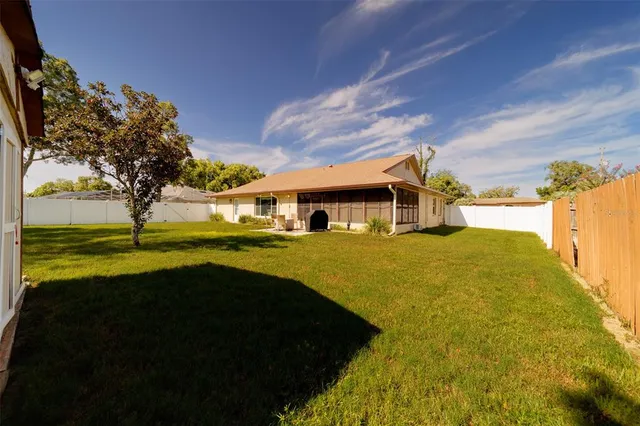 a view of backyard with green space