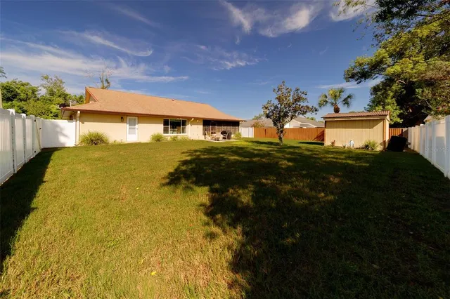 a view of a yard with swimming pool