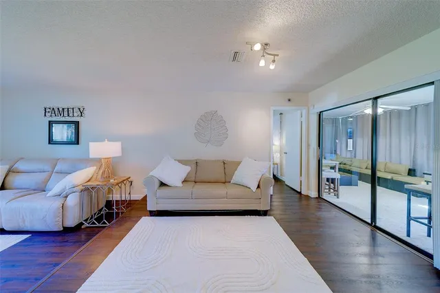 a living room with furniture and a table