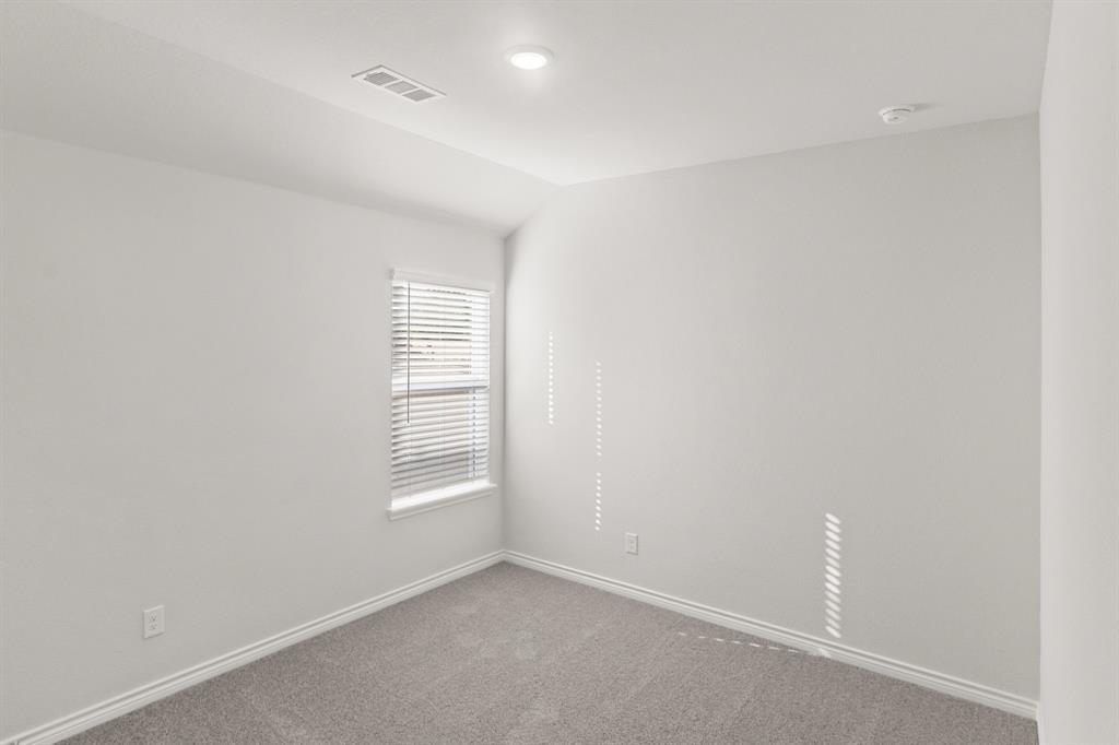 1104 Runway Road Fort Worth, TX 76131 - Photo 11 of 36 an empty room with windows