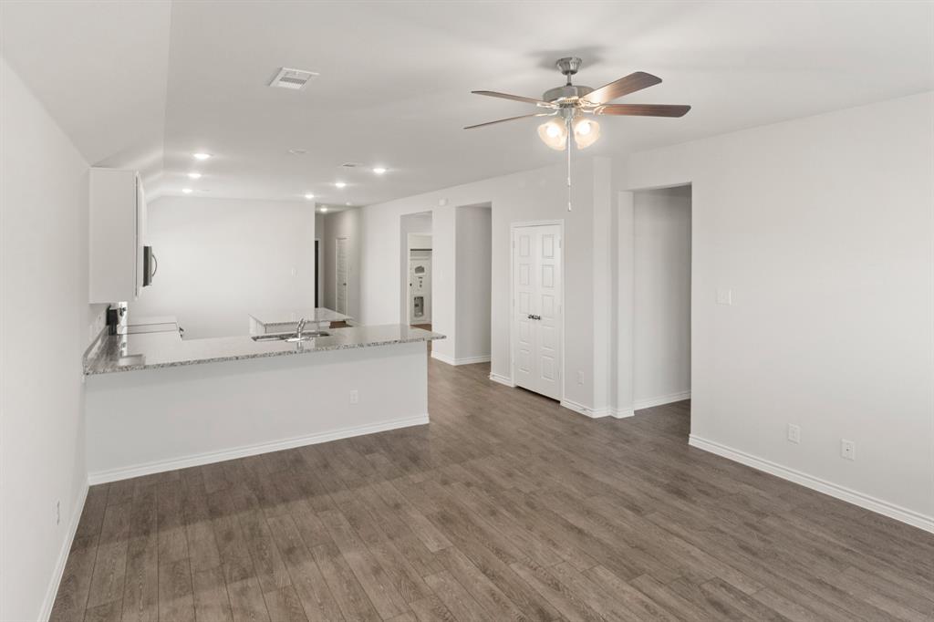 1104 Runway Road Fort Worth, TX 76131 - Photo 7 of 36 a view of an empty room with a ceiling fan