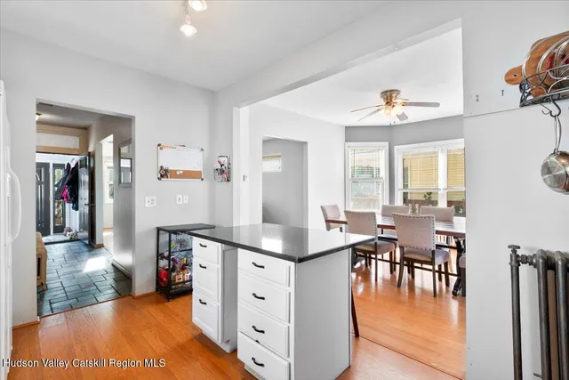 a kitchen with stainless steel appliances a stove a sink and a refrigerator