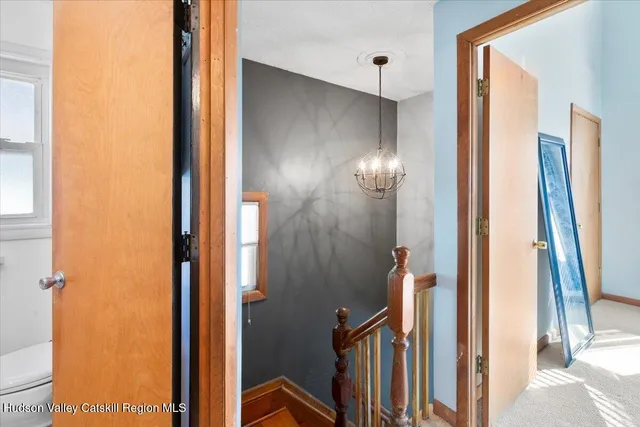 a bedroom with a large bed and a large window