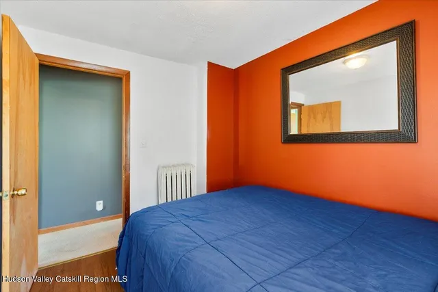 a view of a room with wooden floor and windows