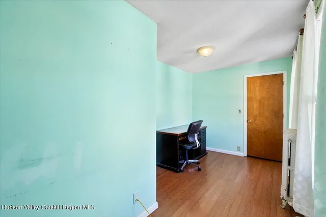 a view of outdoor space with wooden floor