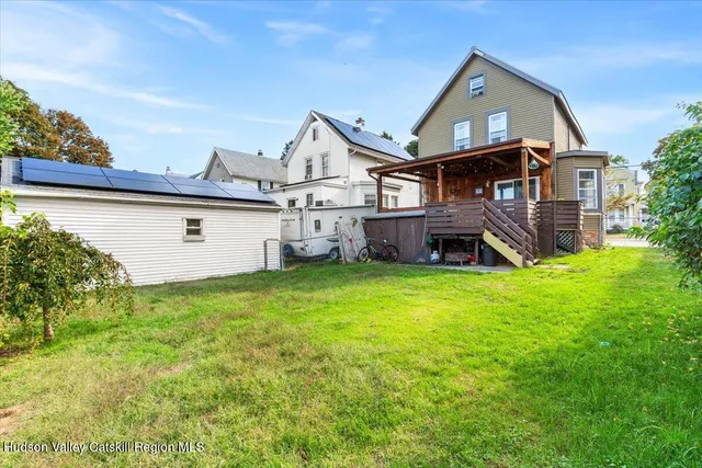 a view of a house with a backyard