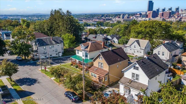 an aerial view of residential houses with outdoor space