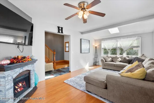 a living room with furniture and a flat screen tv