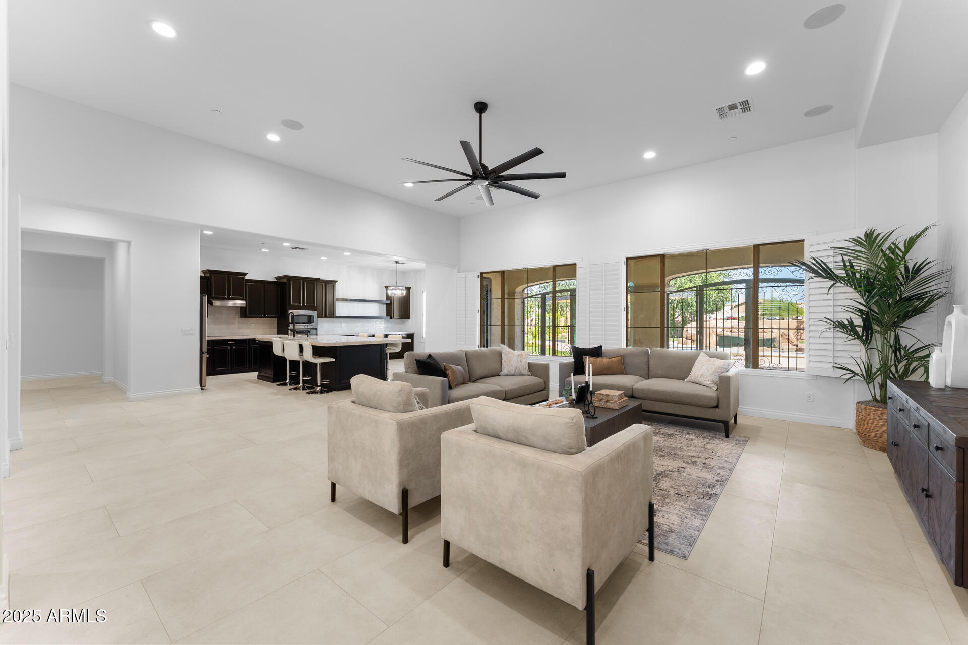 4547 South Banning Drive Gilbert, AZ 85297 - Photo 15 of 45 a living room with furniture kitchen view and a large window