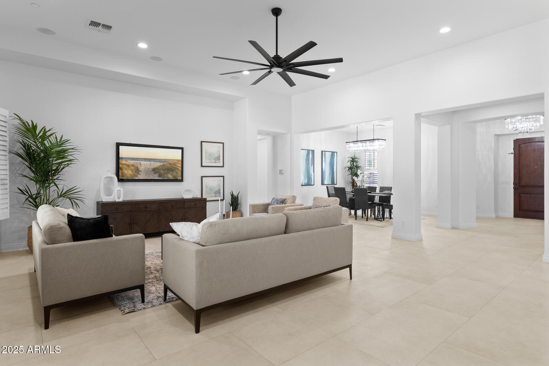 4547 South Banning Drive Gilbert, AZ 85297 - Photo 16 of 45 a living room with furniture and a large window