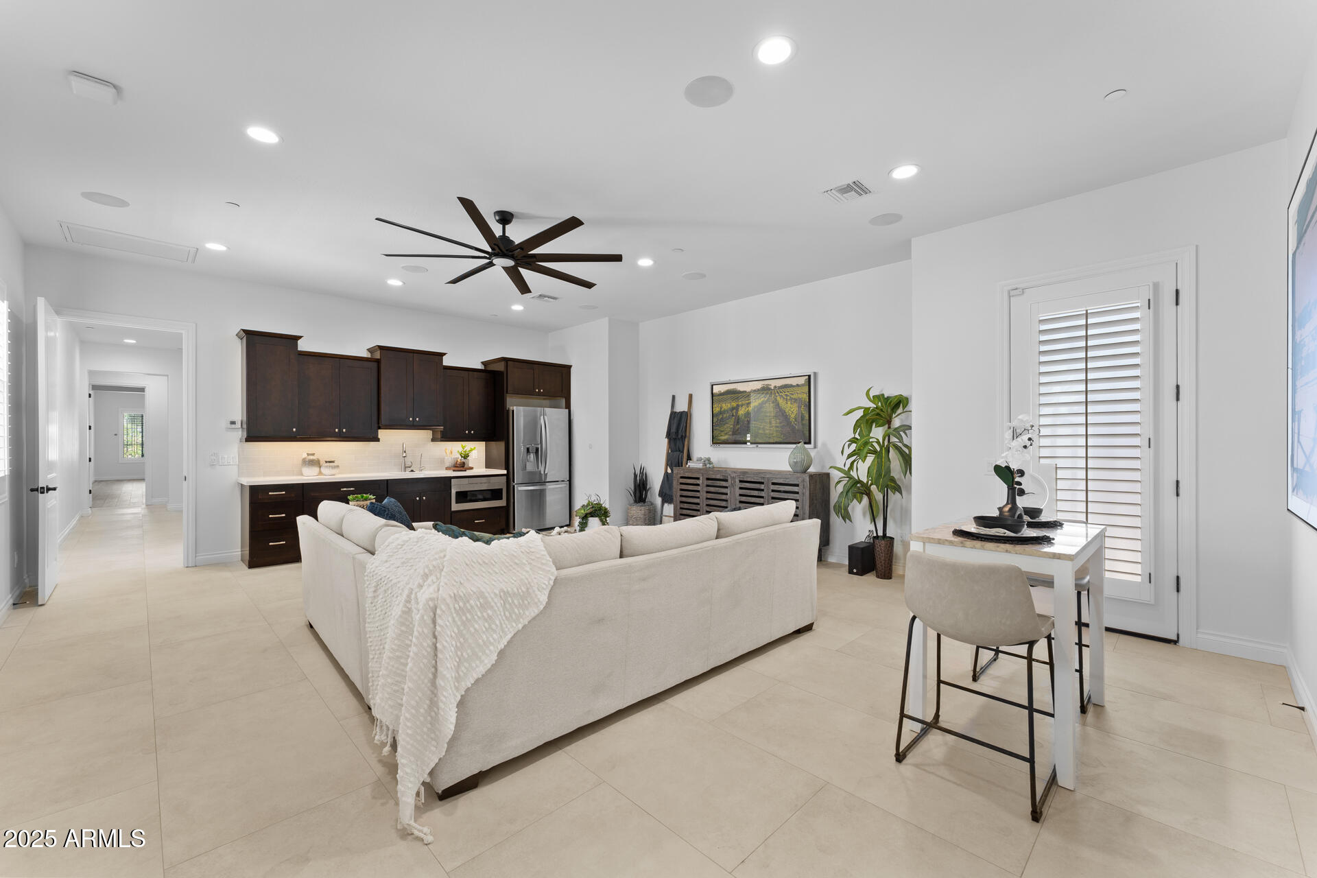 4547 South Banning Drive Gilbert, AZ 85297 - Photo 37 of 45 a living room with furniture and a ceiling fan
