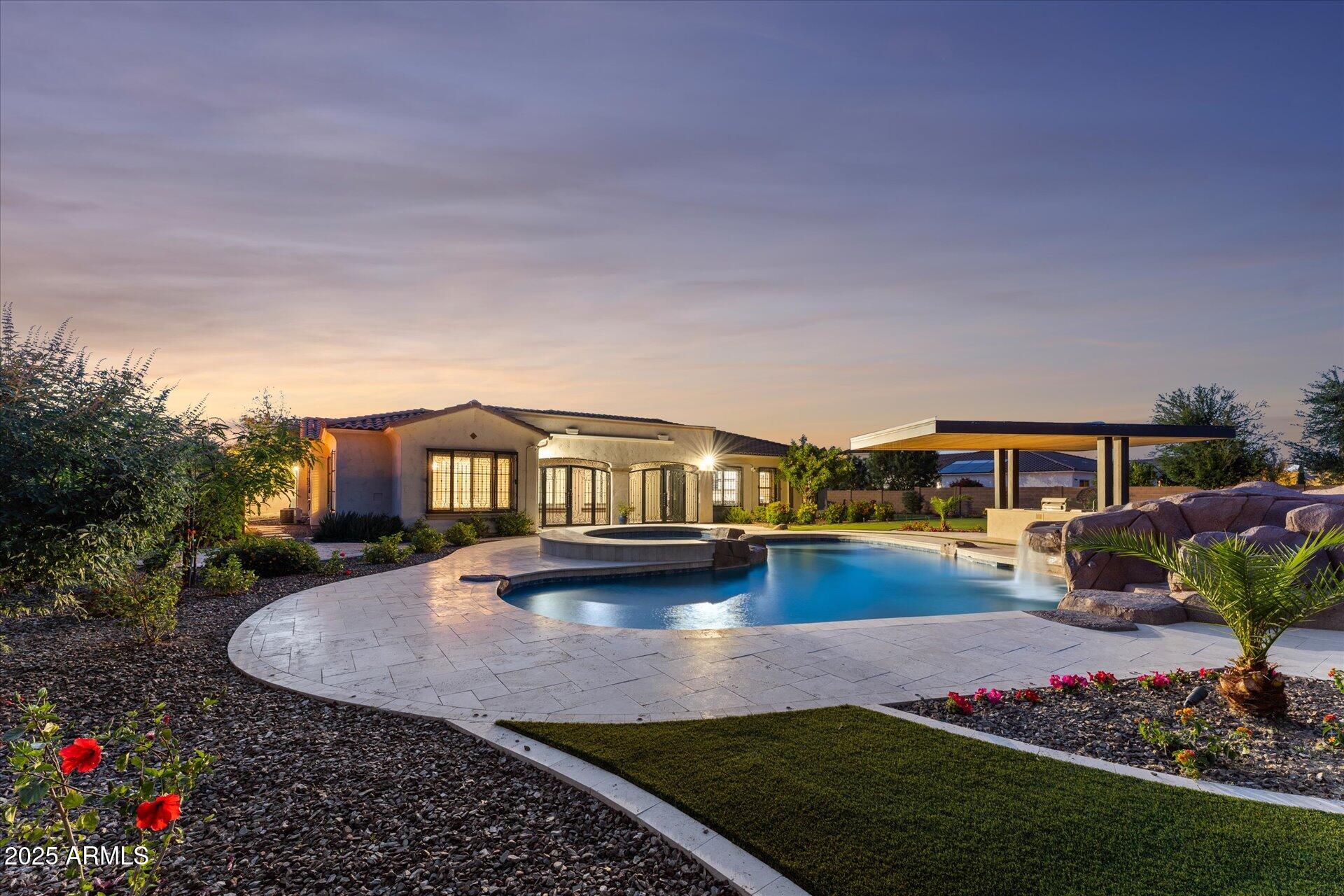 4547 South Banning Drive Gilbert, AZ 85297 - Photo 3 of 45 a front view of a house with garden