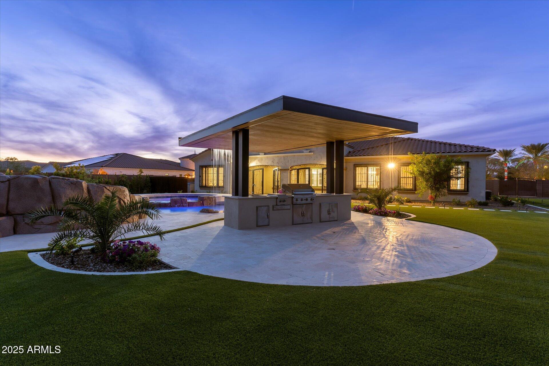 4547 South Banning Drive Gilbert, AZ 85297 - Photo 9 of 45 a front view of a house with a garden