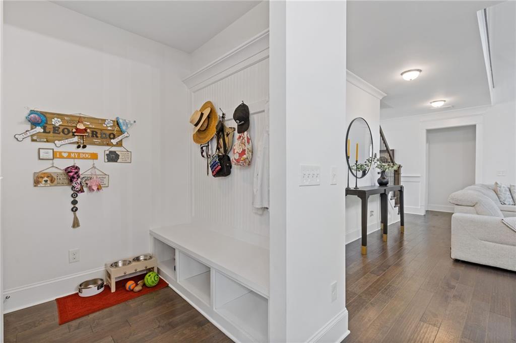 4867 Hunters Grove Way Sugar Hill, GA 30518 - Photo 18 of 61 a living room with furniture and a wooden floor