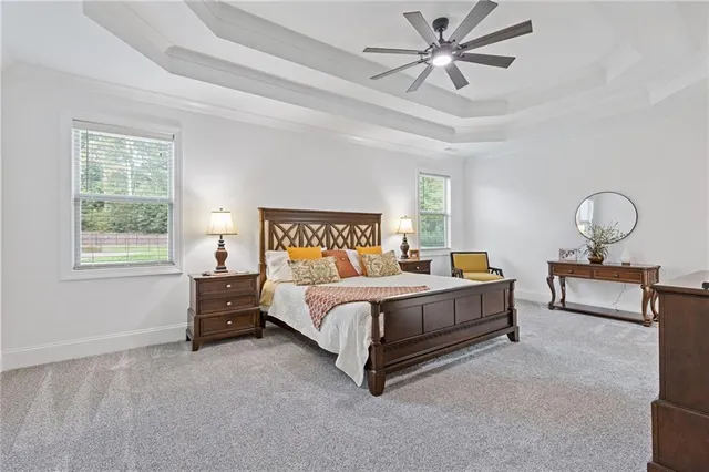 a large bathroom with a tub sink and mirror