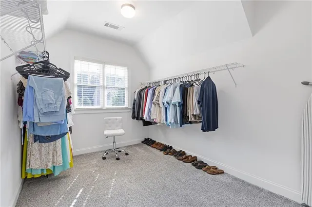 a bathroom with a sink a vanity and a mirror
