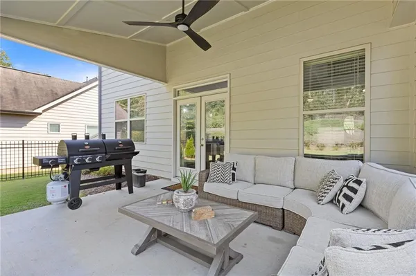 a aerial view of a house with swimming pool and sitting area