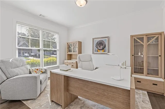 a view of a dining room with furniture window and outside view