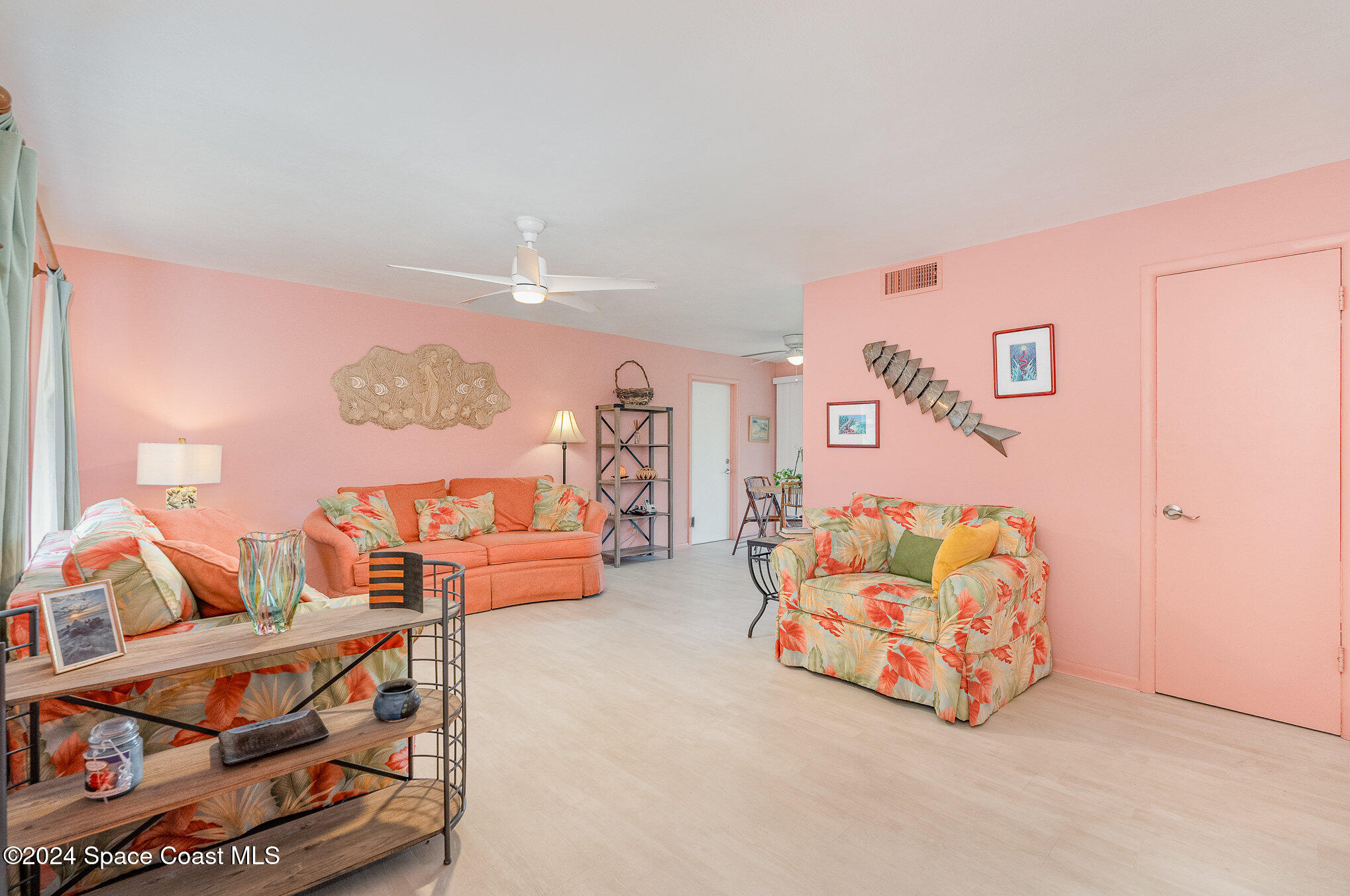 968 Trinidad Road Cocoa Beach, FL 32931 - Photo 3 of 20 a bedroom with furniture and a couch