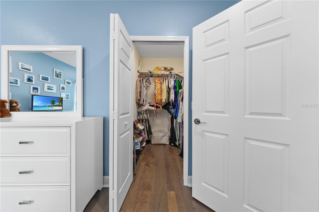 16948 Deer Island Road Tavares, FL 32778 - Photo 32 of 67 a view of a bedroom from a hallway