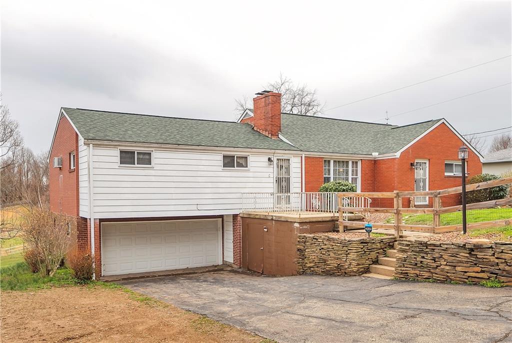 512 Middletown Road New Stanton, PA 15672 - Photo 1 of 24 a view of a house with a yard