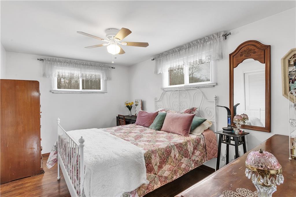 512 Middletown Road New Stanton, PA 15672 - Photo 12 of 24 a bedroom with a bed and a chandelier